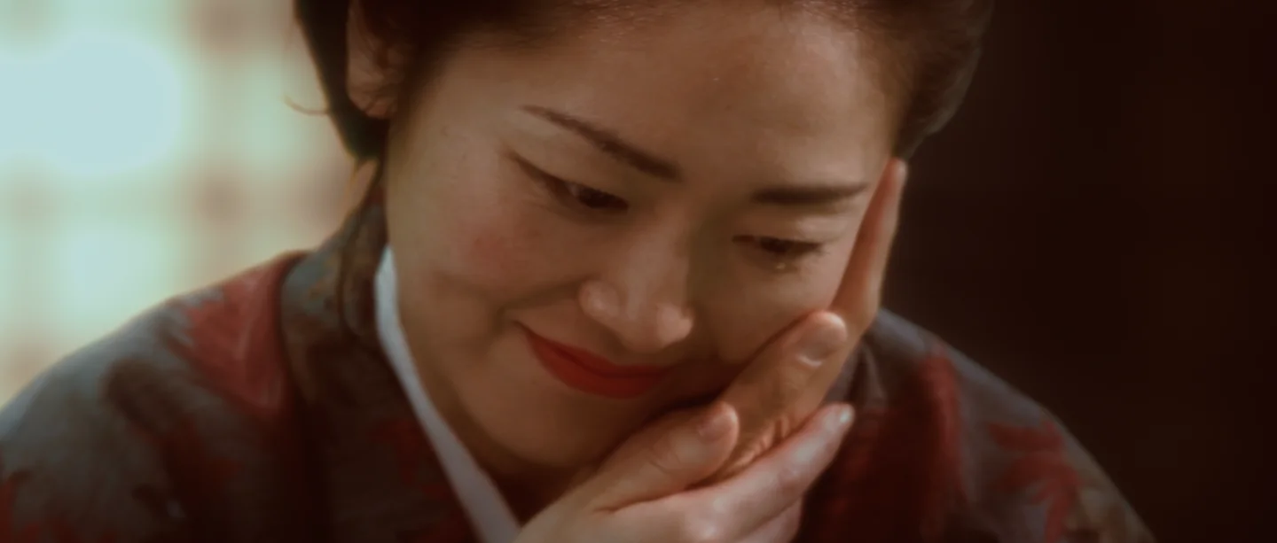 Midori smiling in a tender domestic moment